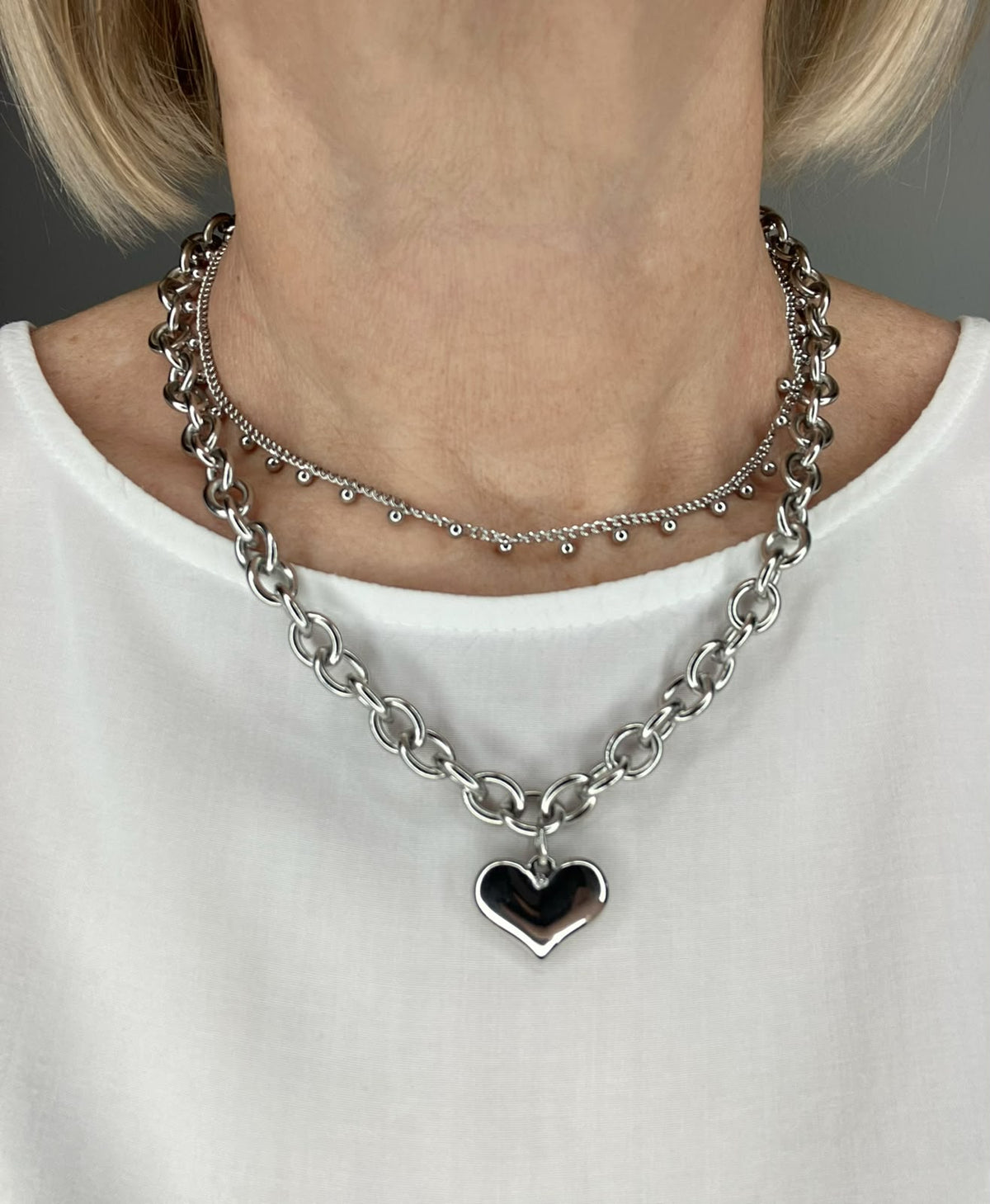 Girocollo Liquid Steel – Collana a Catena in Acciaio Lucido con Ciondolo (Cuore / Stella)