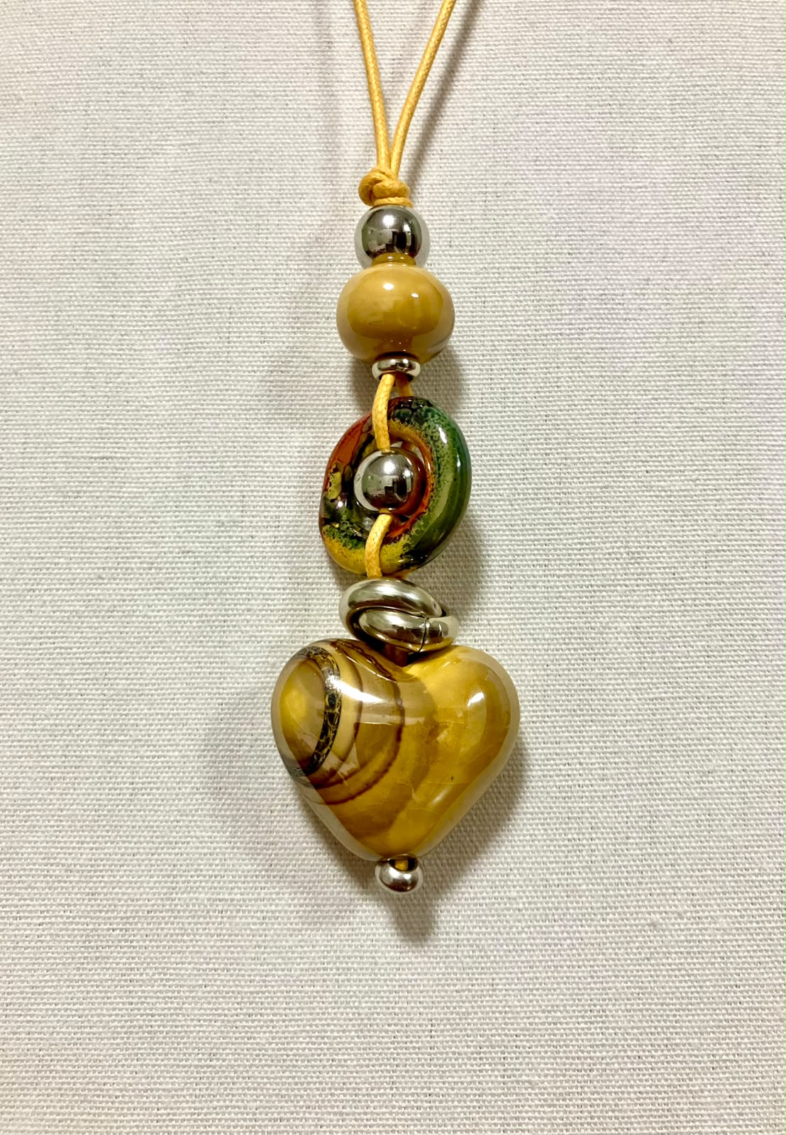 Collana Artigianale "Cuore di Terra" in Ceramica e Acciaio