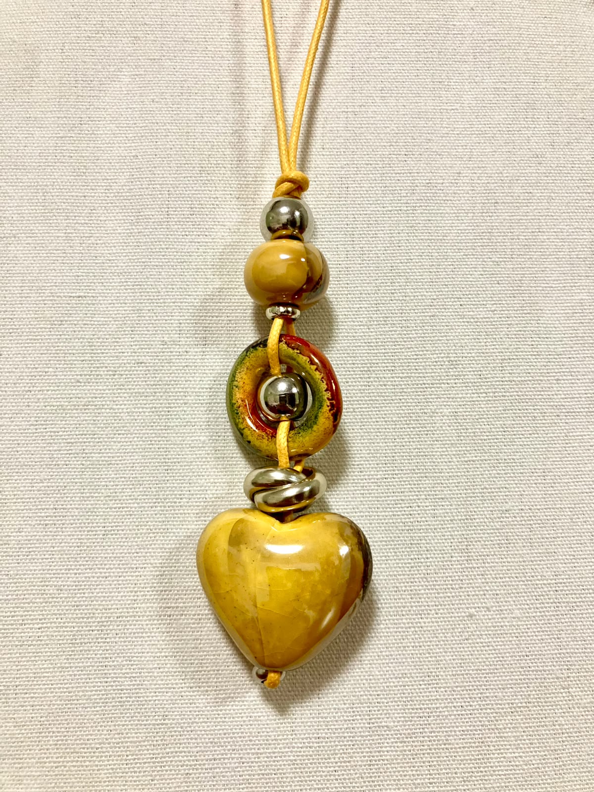 Collana Artigianale "Cuore di Terra" in Ceramica e Acciaio